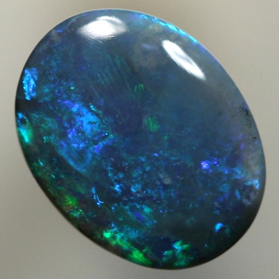 SOLID BLACK OPAL Strong forest greens sparkle over deep ocean blue